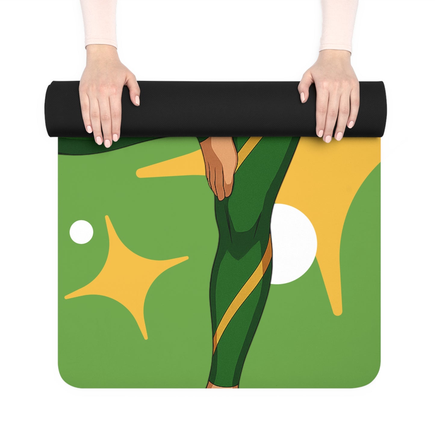 Yoga mat with green and yellow design held by a person